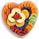A Gift Inside Dried Fruit on Heart Bamboo Serving Tray